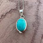 Artisan Turquoise Oval Pendant in Swirl Silver Setting