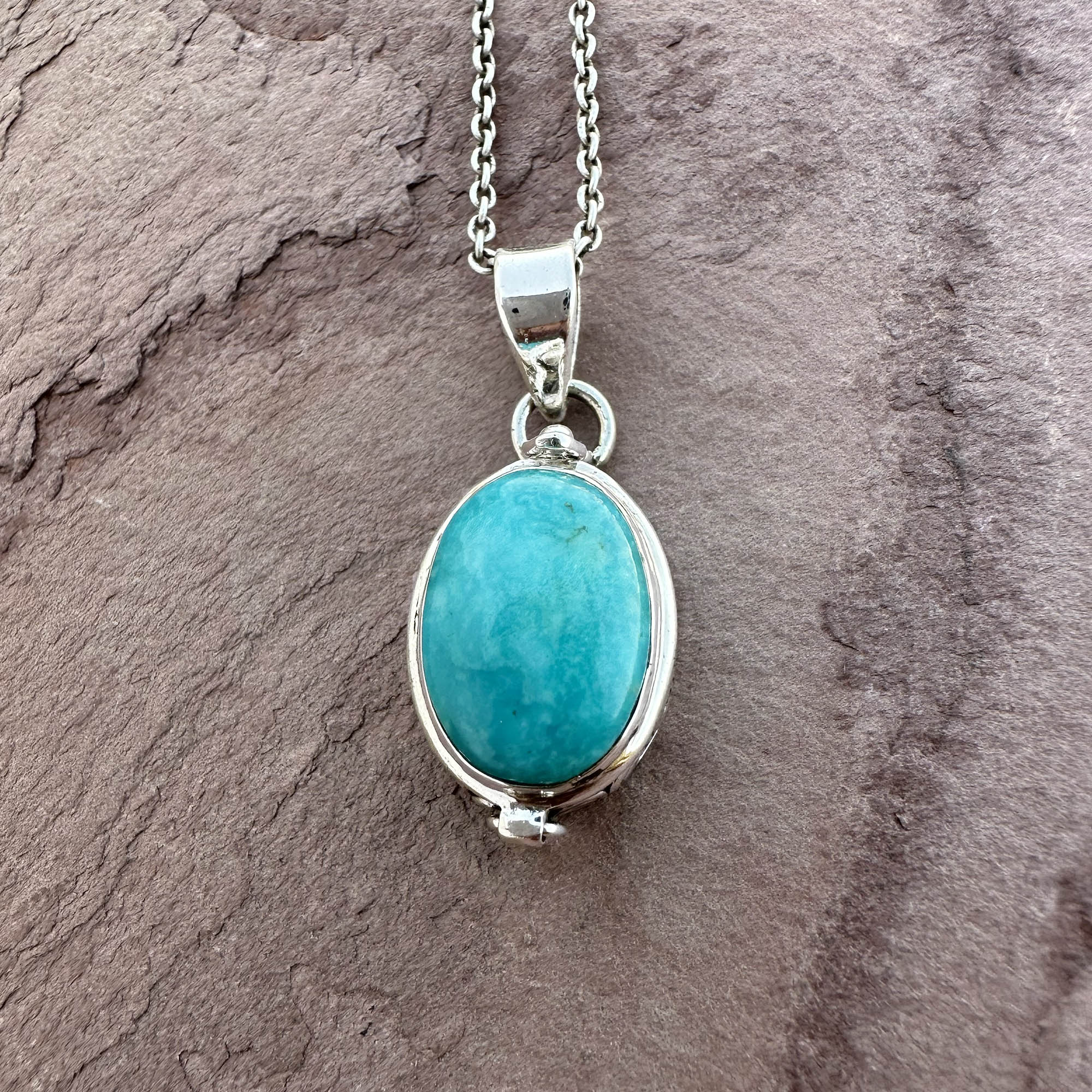Artisan Turquoise Oval Pendant in Swirl Silver Setting