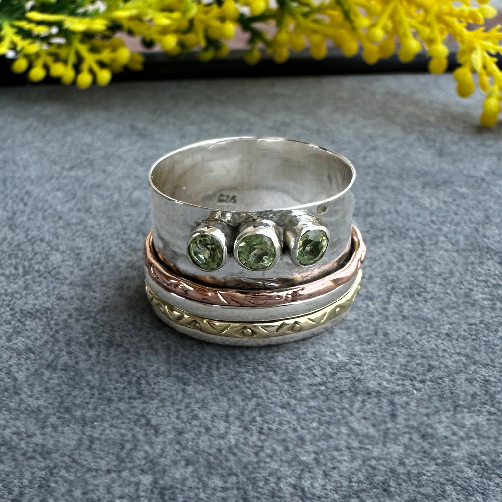 Mixed Metal Spinner Ring with Peridot – Three Peridot Stone Meditation Ring – Sterling Silver, Copper, and Brass Boho Ring