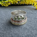 Mixed Metal Spinner Ring with Peridot – Three Peridot Stone Meditation Ring – Sterling Silver, Copper, and Brass Boho Ring
